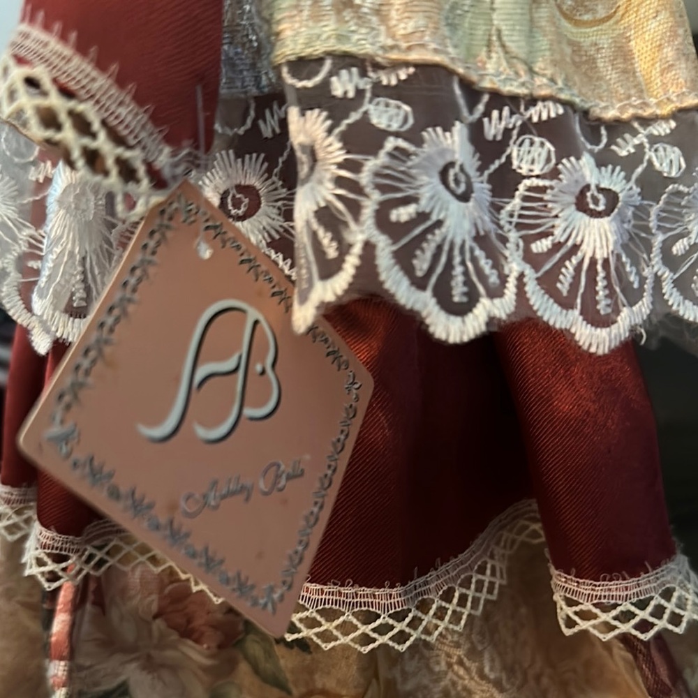 Red and Cream Collectible Doll with Lace Details - Picture 3 of 4